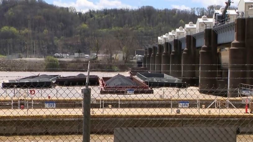 A group of barges sit pinned against the Emsworth lock and dam in Pittsburgh, on Saturday, April 13, 2024. More than two dozen river barges broke loose from their moorings and floated down the Ohio River, damaging a marina and striking a bridge. (WTAE via AP)