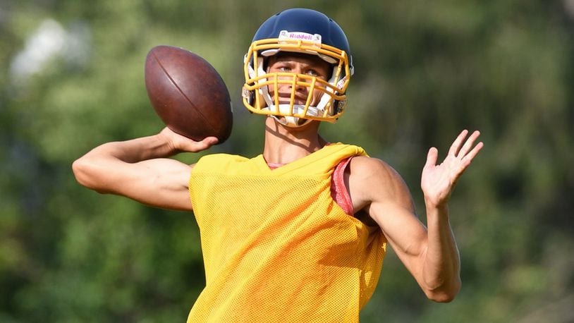 Tyler Carter throws a pass during a practice on Monday morning at Springfield High School. Carter is a senior who transfered from Wayne in the offseason and is one of the leading candidates to start at quarterback. Contributed Photo Bryant Billing