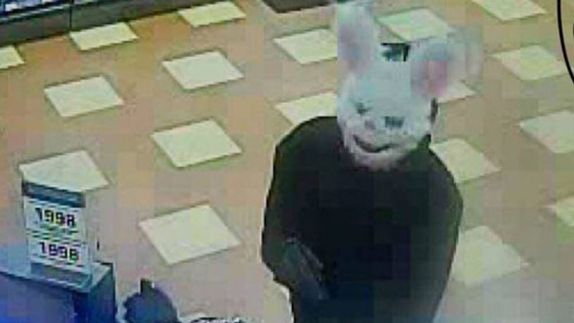 Police are trying to find thieves who have been robbing businesses while wearing animal masks.