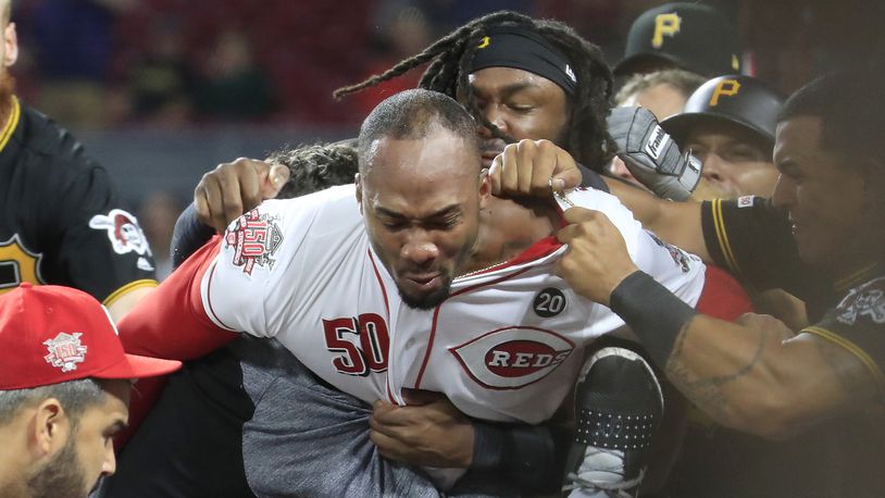 CINCINNATI, OHIO - JULY 30: Amir Garrett #50 (middle white shirt with out hat) of the Cincinnati Reds engages members of the Pittsburgh Pirates during a bench clearing altercation in the 9th inning of the game  at Great American Ball Park on July 30, 2019 in Cincinnati, Ohio. (Photo by Andy Lyons/Getty Images)