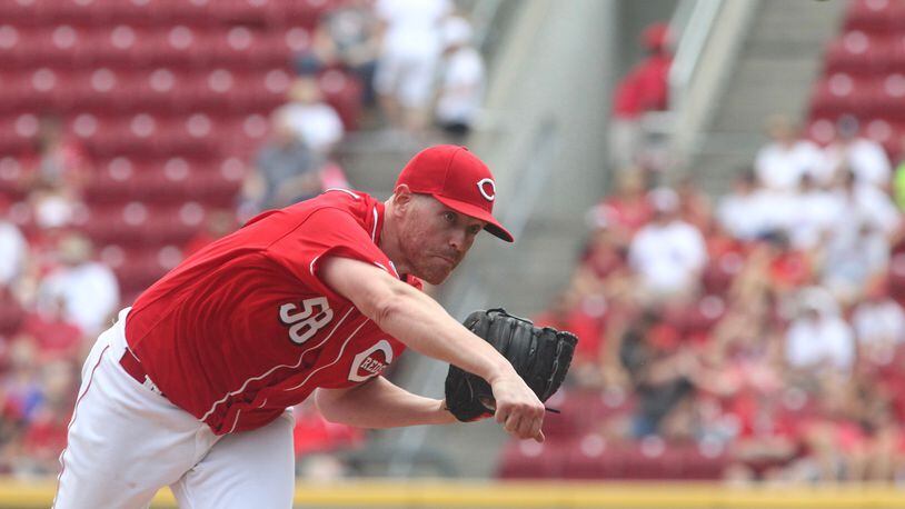Reds starter Dan Straily pitches against the Brewers on Sunday, July 17, 2016, at Great American Ball Park in Cincinnati. David Jablonski/Staff