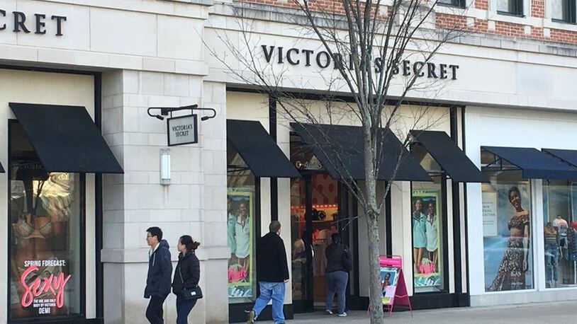 Shoppers pass by the Victoria’s Secret at The Greene Town Center in Beavercreek. KARA DRISCOLL/STAFF