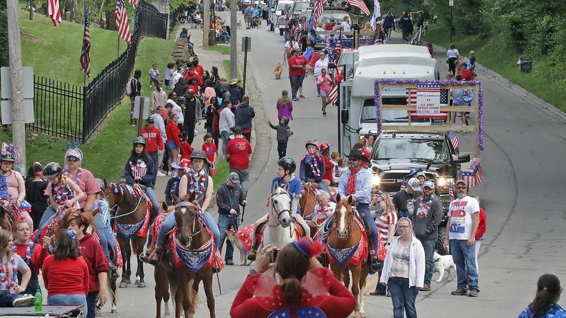 The annual Springfield Memorial Day Parade is set to take place this year amid the pandemic. Hundreds of people cheered and waved flags along the streets of Springfield last year as the annual Memorial Day Parade returned after being canceled in 2020 due to COVID-19. BILL LACKEY/STAFF