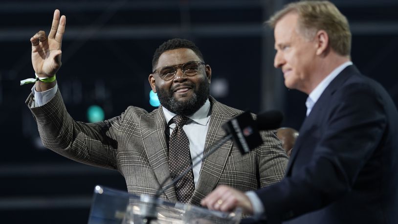 NFL Hall of Famer Orlando Pace waves as he is introduced before the second round of the NFL football draft, Friday, April 30, 2021, in Cleveland. (AP Photo/Tony Dejak)