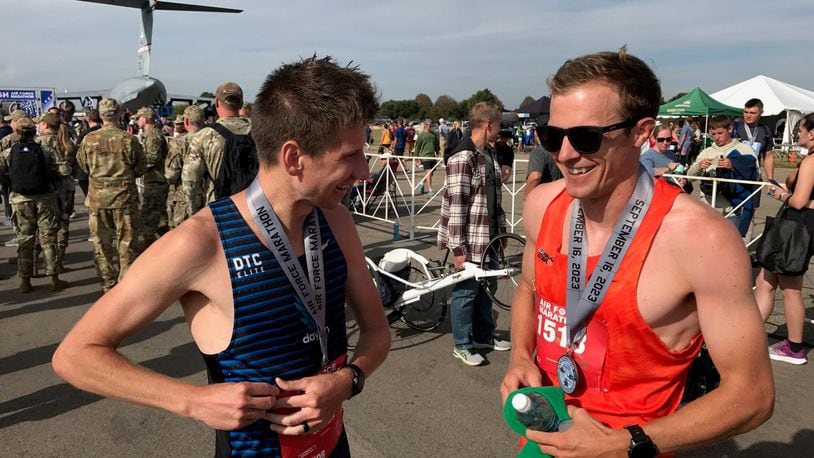 The 2023 Air Force Marathon winnner Jason Salyer (left) and runner-up Connor Roche talk after the race. They met on the course and had a side-by-side battle for much of the race.