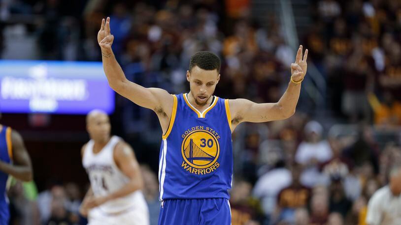 Golden State Warriors guard Stephen Curry (30) celebrates a basket against the Cleveland Cavaliers during the second half of Game 4 of basketball's NBA Finals in Cleveland, Friday, June 10, 2016. (AP Photo/Tony Dejak)