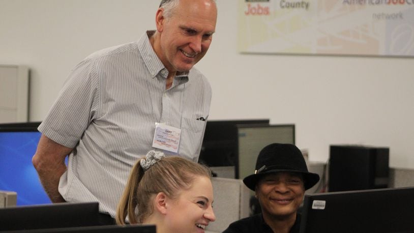 University of Dayton student Claire Vogel helped prepare and submit 58-year-old Teresa Rainey’s tax returns on Saturday at the Job Center. Volunteer Gary Dowdy also helped low- and moderate-income residents file their returns. CORNELIUS FROLIK / STAFF