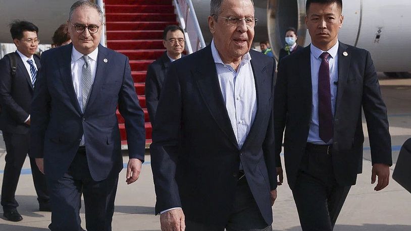 In this photo released by Russian Foreign Ministry Press Service on Monday, April 8, 2024, Russian Foreign Minister Sergey Lavrov, center, walks from the plane upon his arrival in Beijing, China. Russian Foreign Minister Sergey Lavrov is visiting Beijing to display the strength of ties with close diplomatic ally China amid Moscow's grinding war against Ukraine. (Russian Foreign Ministry Press Service via AP)