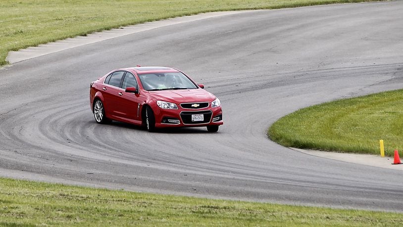 A car drifts around a curve in a driver training course at the Transportation Research Center Inc. in East Liberty Friday, June 9, 2017. Bill Lackey/Staff