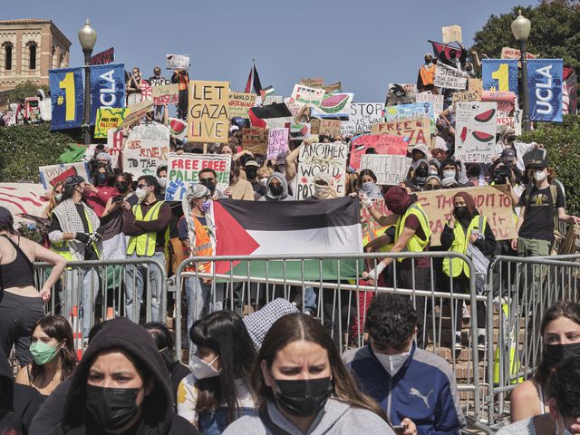 Pro-Palestinian demonstrators near an encampment on the UCLA campus in Los Angeles, May 1, 2024. (Philip Cheung/The New York Times)