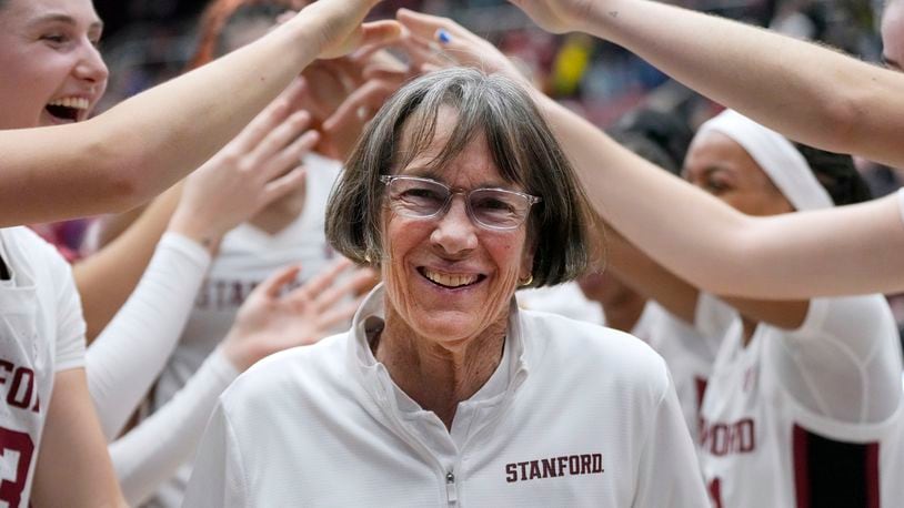 FILE - Stanford coach Tara VanDerveer smiles as players celebrate her 1,202nd victory as a college coach following an NCAA basketball game against Oregon, Friday, Jan. 19, 2024, in Stanford, Calif. VanDerveer, the winningest basketball coach in NCAA history, announced her retirement Tuesday night, April 9, 2024, after 38 seasons leading the Stanford women’s team and 45 years overall. (AP Photo/Tony Avelar, File)