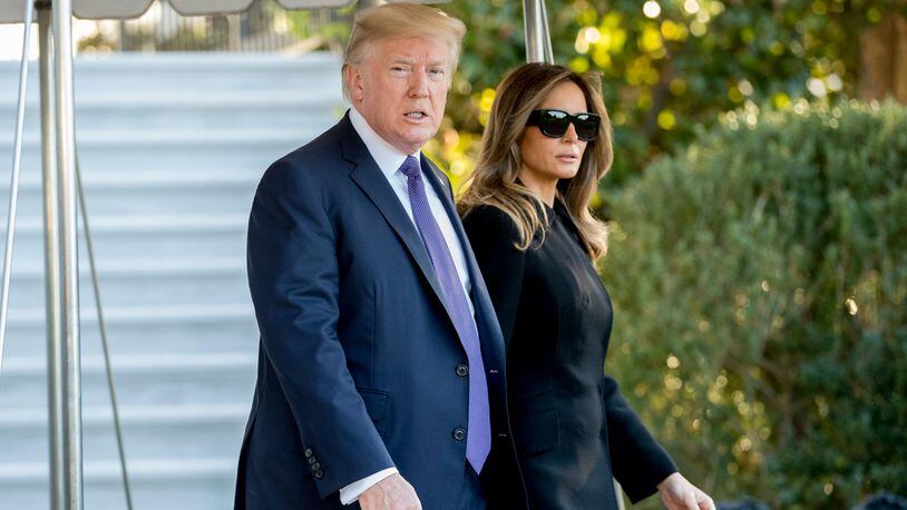 President Donald Trump and first lady Melania Trump walk toward Marine One on the South Lawn of the White House in Washington, Wednesday, Oct. 4, 2017, for a short trip to Andrews Air Force Base, Md., and then on to Las Vegas to visit with victims and first responders affected by the worst mass shooting in American history. (AP Photo/Andrew Harnik)