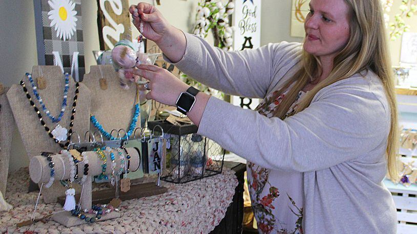 HILLBILLYHIPPIE owner Sarah Blair opened her store in downtown Mechanicsburg selling crafts and art work from recycled material. JEFF GUERINI/STAFF
