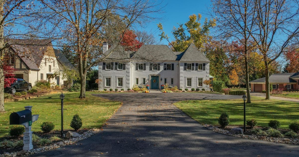 Colonial home adjacent to golf course