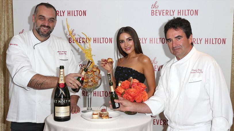 (L-R) Executive Chef Alberico Nunizata, Olivia Culpo, and Executive Pastry Chef Thomas Henzi attend The Beverly Hilton unveils the menu for the 74th Annual Golden Globe Awards at The Beverly Hilton Hotel on January 3, 2017 in Beverly Hills, California.