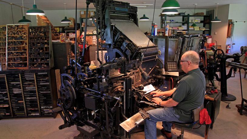 Volunteer Dennis Behm works in the Carillon Historical Park Print Shop. CONTRIBUTED/SKIP PETERSON