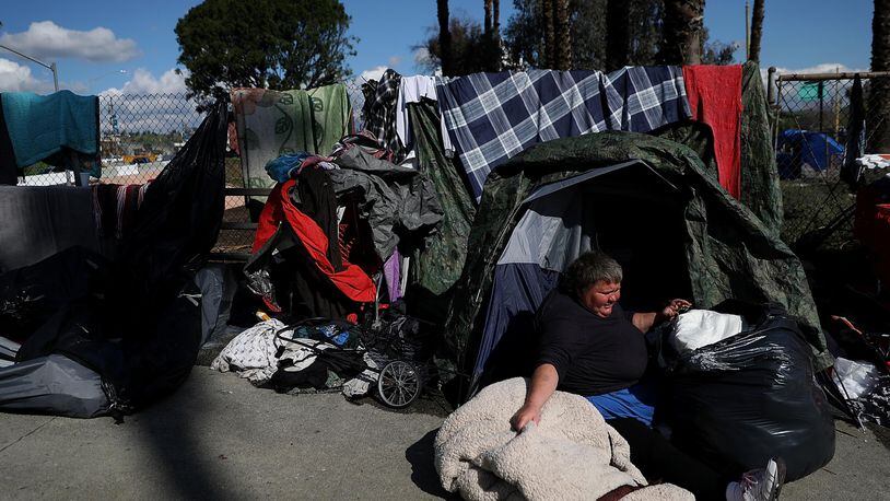 FILE PHOTO:  Lisa Rogers, a homeless woman, packs up to relocate her camp in Los Angeles, California.