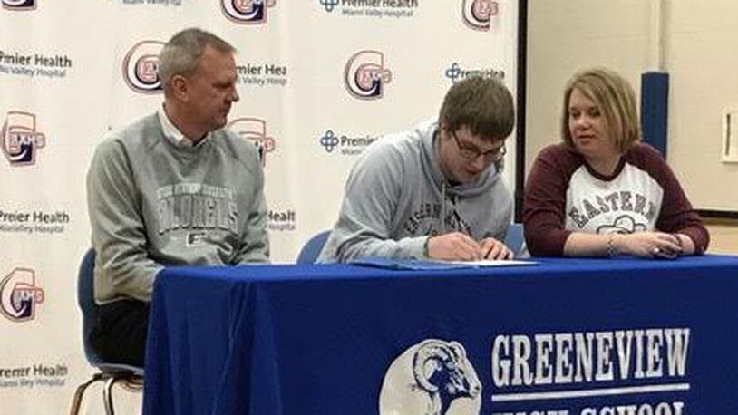 Joining Ethan Bradds (center) on signing day at Greeneview High School were his father David Bradds (left) and mother Michelle Bradds. CONTRIBUTED PHOTO