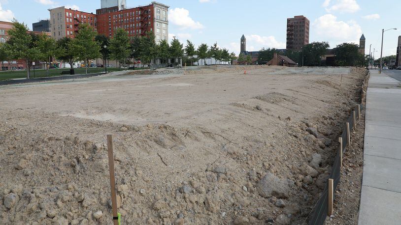 The site has been prepped and is just waiting for the new townhomes to be built along Center Street in downtown Springfield. BILL LACKEY/STAFF