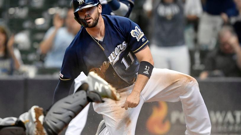 MILWAUKEE, WISCONSIN - JUNE 30: Mike Moustakas #11 of the Milwaukee Brewers scores in the fourth inning against the Pittsburgh Pirates at Miller Park on June 30, 2019 in Milwaukee, Wisconsin. (Photo by Quinn Harris/Getty Images)