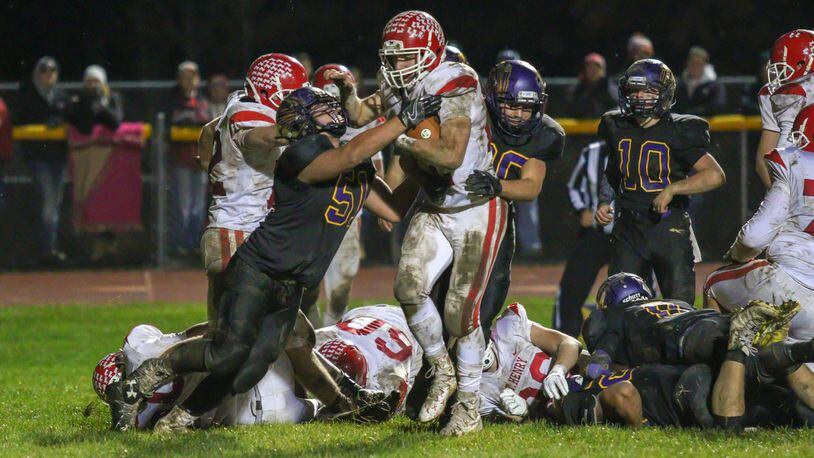 St. Henry senior Zach Niekamp runs for one of his four touchdowns on the night as the Redskins beat Mechanicsburg 37-7 in a Division VI, Region 24 quarterfinal game at Indian Stadium on Friday night. CONTRIBUTED PHOTO BY MICHAEL COOPER