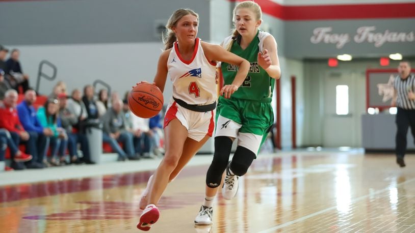 Rylee Sagester of Tri-Village drives toward the hoop vs. Fayetteville-Perry at Troy High School on Saturday, Feb. 25, 2023. Michael Cooper/CONTRIBUTED