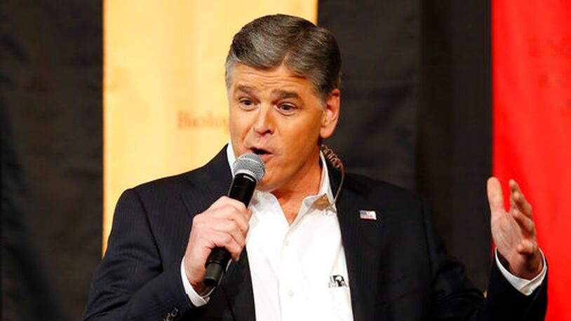 FILE - In this March 18, 2016, file photo, Fox News Channel's Sean Hannity speaks during a campaign rally for Republican presidential candidate, Sen. Ted Cruz, R-Texas, in Phoenix. Hannity told the New York Daily News for a story published April 23, 2017, that  accusations of sexual harassment from former Fox News contributor Debbie Schlussel are â100% false and a complete fabrication.â(AP Photo/Rick Scuteri, File)