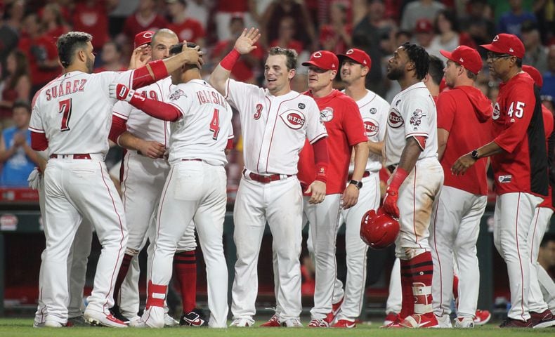 Photos: Reds beat Brewers on wild play in 11th