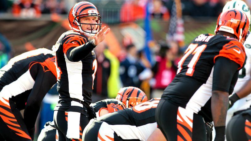 Cincinnati Bengals quarterback Andy Dalton (14) calls a play at the line during a game against the Jets at Paul Brown Stadium in Cincinnati, Ohio, Oct. 27, 2013. Dalton tossed five touchdown passes in the 49-9 win. NICK DAGGY / STAFF