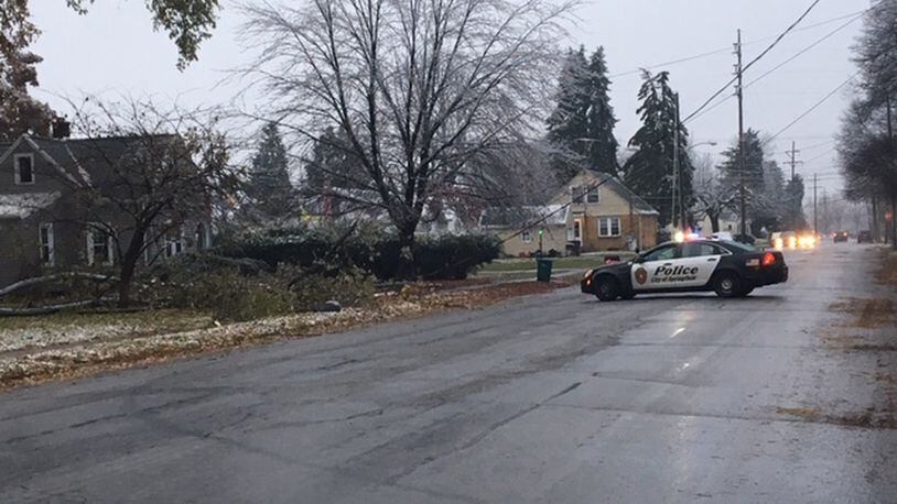 Springfield Police block South Belmont Avenue Thursday after a tree fell on a power line. JENNA LAWSON/STAFF