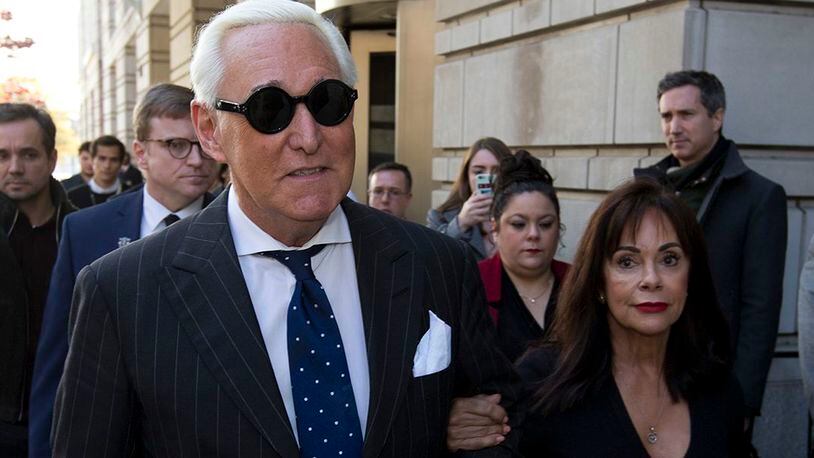 Roger Stone, left, with his wife Nydia Stone, leaves federal court in Washington, Friday, Nov. 15, 2019.)