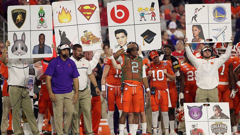 GLENDALE, AZ - DECEMBER 31:  The Clemson Tigers sidelines holds up play cards during the Playstation Fiesta Bowl against the Ohio State Buckeyes at University of Phoenix Stadium on December 31, 2016 in Glendale, Arizona. The Tigers defeated the Buckeyes 31-0.  (Photo by Christian Petersen/Getty Images)