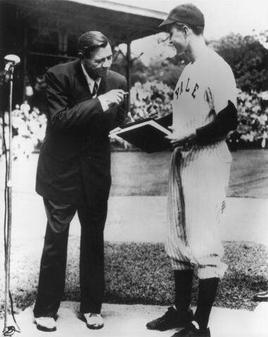 1946: New York Yankees baseball legend Babe Ruth shakes hands with George Bush after signing an autograph for him