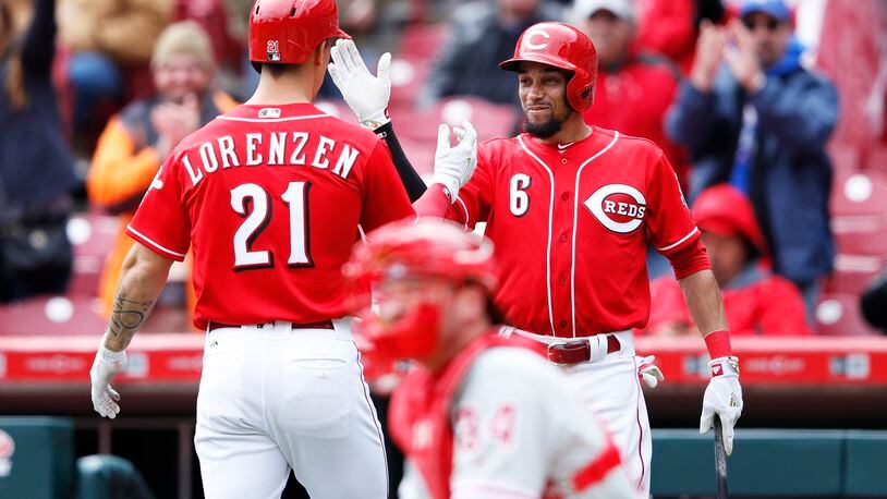 CINCINNATI, OH - APRIL 06: Michael Lorenzen #21 of the Cincinnati Reds is congratulated by Billy Hamilton #6 after hitting a solo home run to break a tie in the sixth inning of the game against the Philadelphia Phillies at Great American Ball Park on April 6, 2017 in Cincinnati, Ohio. (Photo by Joe Robbins/Getty Images)