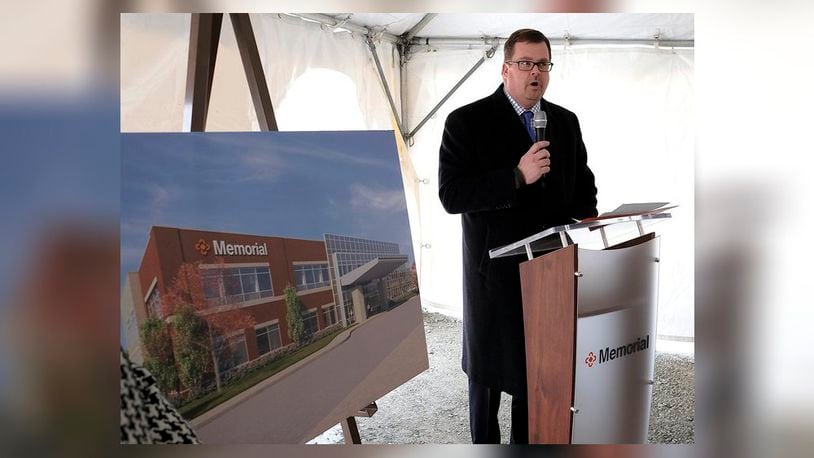 Chip Hubbs, president and CEO of Memorial Health, speaks during a ground breaking ceremony for a new Memorial Health outpatient medical center in Urbana Friday. Bill Lackey/Staff