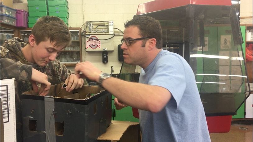 Tom Jenkins, right, teaches a student at Greenon Junior/Senior High School. Jenkins was selected to participate in the NOAA Teacher at Sea program.