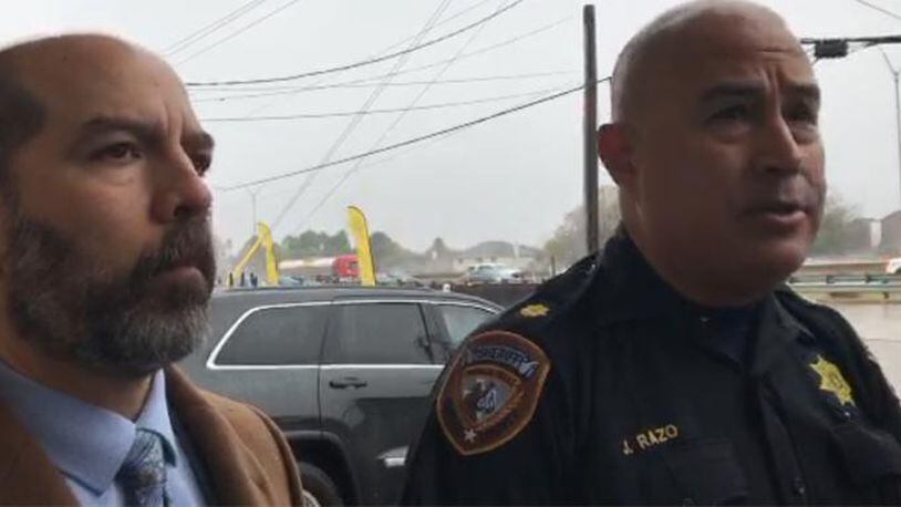 Harris County Sheriff's Office representatives speak to members of the press about a fatal drive-by shooting outside a Walmart near Houston on Sunday.