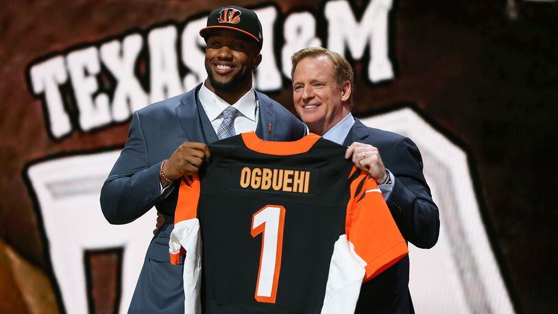 CHICAGO, IL - APRIL 30: Cedric Ogbuehi of the Texas A&M Aggies holds up a jersey with NFL Commissioner Roger Goodell after being picked #21 overall by the Cincinnati Bengals during the first round of the 2015 NFL Draft at the Auditorium Theatre of Roosevelt University on April 30, 2015 in Chicago, Illinois. (Photo by Jonathan Daniel/Getty Images)