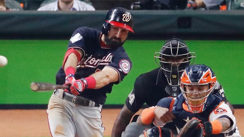 The Nationals' Adam Eaton hits an RBI single against the Houston Astros during the fifth inning in Game One of the 2019 World Series at Minute Maid Park on October 22, 2019 in Houston, Texas. (Photo by Tim Warner/Getty Images)