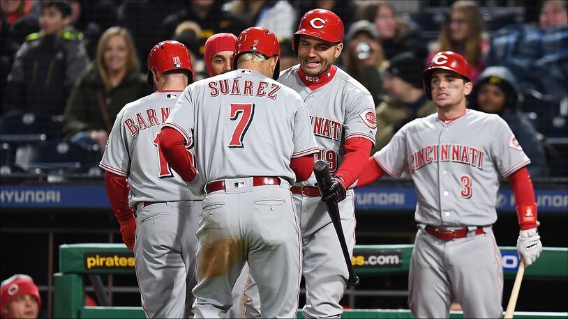 PITTSBURGH, PA - APRIL 07:  Eugenio Suarez #7 of the Cincinnati Reds celebrates with teammates after hitting a three run home run during the eighth inning against the Pittsburgh Pirates at PNC Park on April 7, 2018 in Pittsburgh, Pennsylvania. (Photo by Joe Sargent/Getty Images)