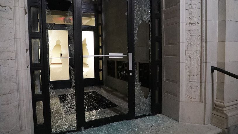 One of the broken windows at the Springfield City Hall on Monday that was vandalized the day before, on May 31. BILL LACKEY/STAFF