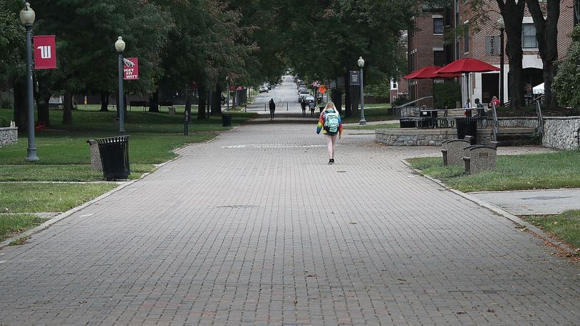 Only a few students walked around on campus at Wittenberg University Friday. BILL LACKEY/STAFF
