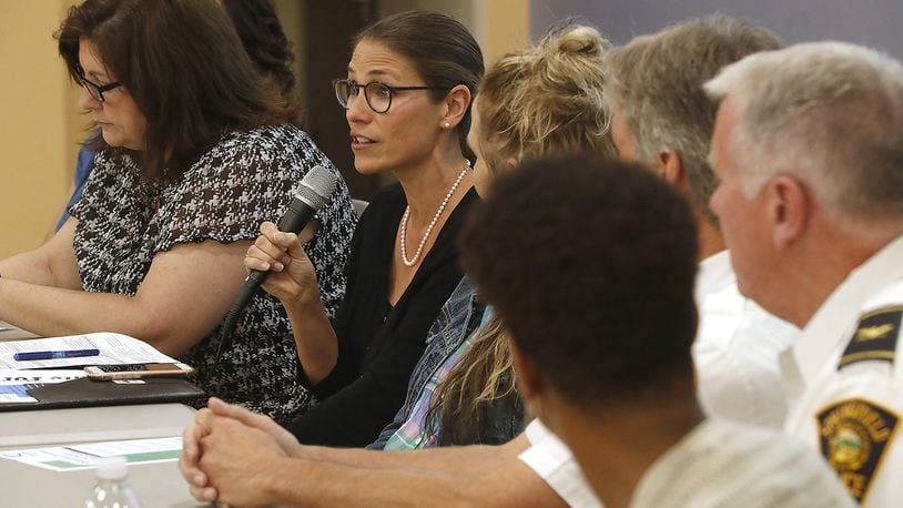Greta Mayer, CEO the Mental Health and Recovery Board of Clark, Greene and Madison Counties, answers a question as part of the panel during the community-wide forum on the opioid crisis in Clark County Tuesday. Bill Lackey/Staff