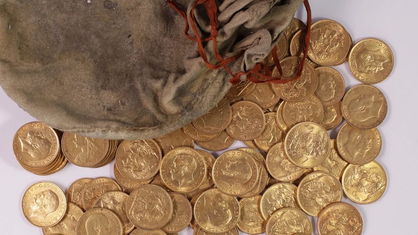 An undated handout photograph, taken at an unknown location, shows part of a hoard of gold coins, made between 1847 and 1915, discovered hidden in an upright piano made by Broadwood & Sons of London and sold to a music establishment in Essex, England, in 1906. British officials are trying to trace the owner of a trove of gold coins worth a "life-changing" amount of money found stashed inside a piano. A coroner investigating the find on Thursday  March 16, 2017 urged anyone with information to come forward. (Portable Antiquities Scheme/Trustees of the British Museum/Peter Reavill via AP)