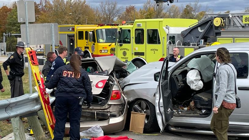 One person was taken by medical helicopter following a two-vehicle crash that caused multiple injuries Tuesday, Oct. 18, 2022, at Upper Valley Pike and state Routes 4/40 in Springfield Twp. BILL LACKEY/STAFF