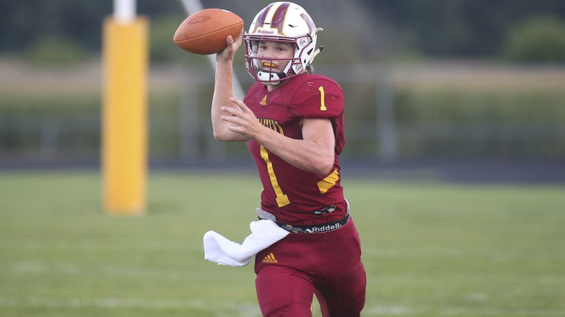 Northeastern High School quarterback Cade Houseman throws the ball during a game against Greeneview last season. CONTRIBUTED PHOTO BY MICHAEL COOPER