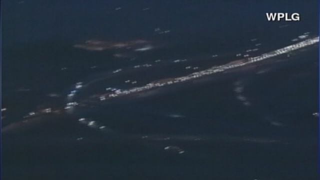Truck dangles off Miami freeway