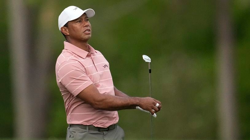 Tiger Woods watches his tee shot on the 12th hole during the first round at the Masters golf tournament at Augusta National Golf Club Thursday, April 11, 2024, in Augusta, Ga. (AP Photo/George Walker IV)