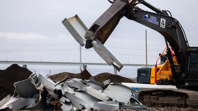 A shearer breaks apart salvaged pieces of the collapsed Francis Scott Key Bridge at Tradepoint Atlantic, Friday, April 12, 2024, in Sparrows Point, Md. (AP Photo/Julia Nikhinson)