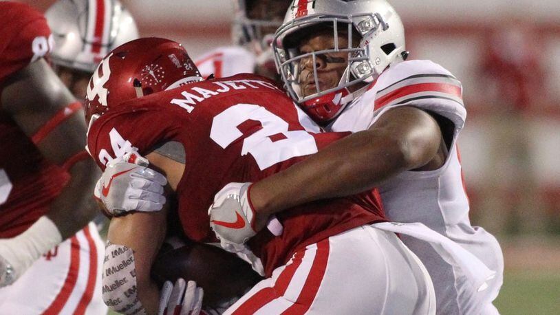Ohio State’s Dre’mont Jones tackles Indiana’s Mike Majette on Thursday, Aug. 31, 2017, at Memorial Stadium in Bloomington, Ind. David Jablonski/Staff